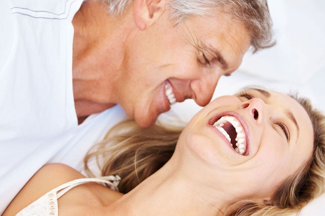 Happy woman and a middle-aged man with no potency issues